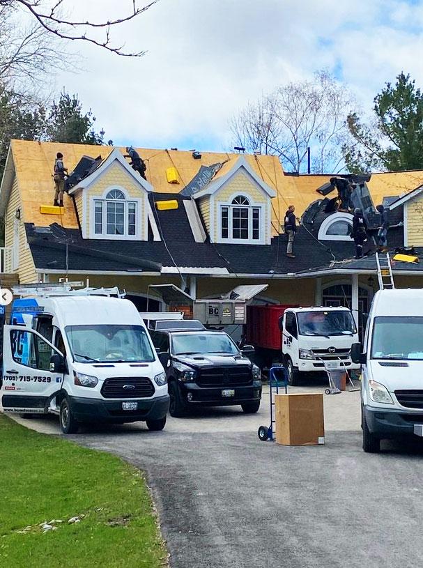 BC Roofing contractors on site to reshingle a home with their crew.